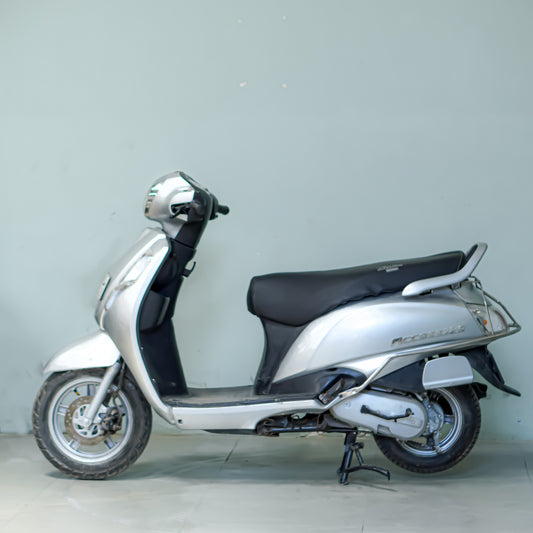 Used Suzuki Access 125 silver left side view in Gurgaon family scooter good condition