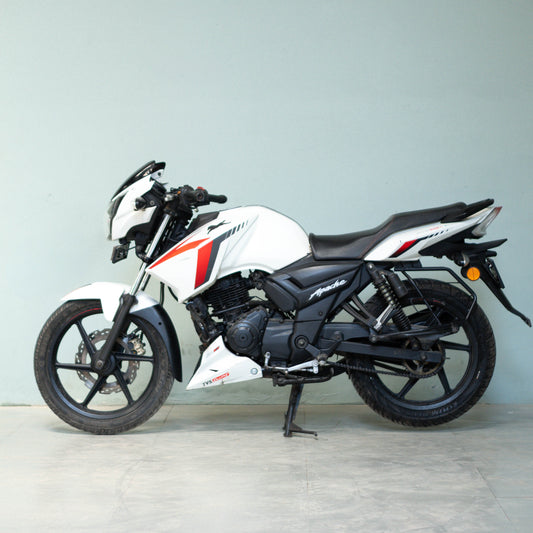White motorcycle with black and red accents on a light gray background used-tvs-apache-rtr-160-4v-gurgaon