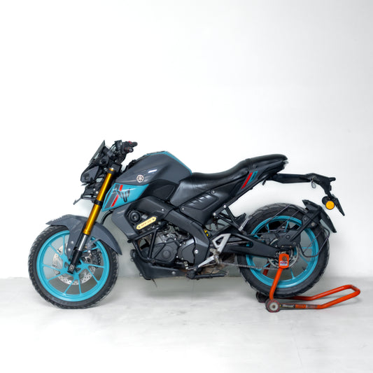 used mt 15 gurgaon Black motorcycle with blue wheels on a white background