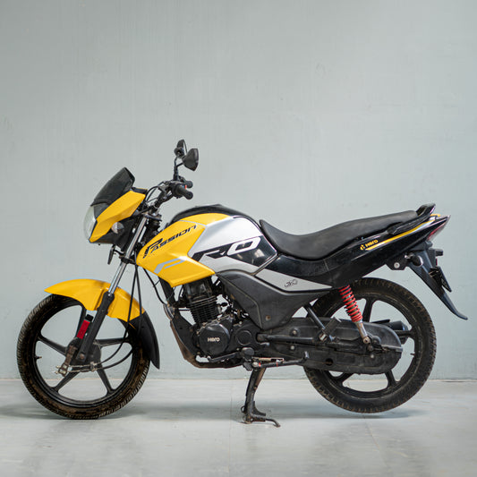 Hero Passion Pro yellow black left side view used bike in Gurgaon mileage commuter motorcycle