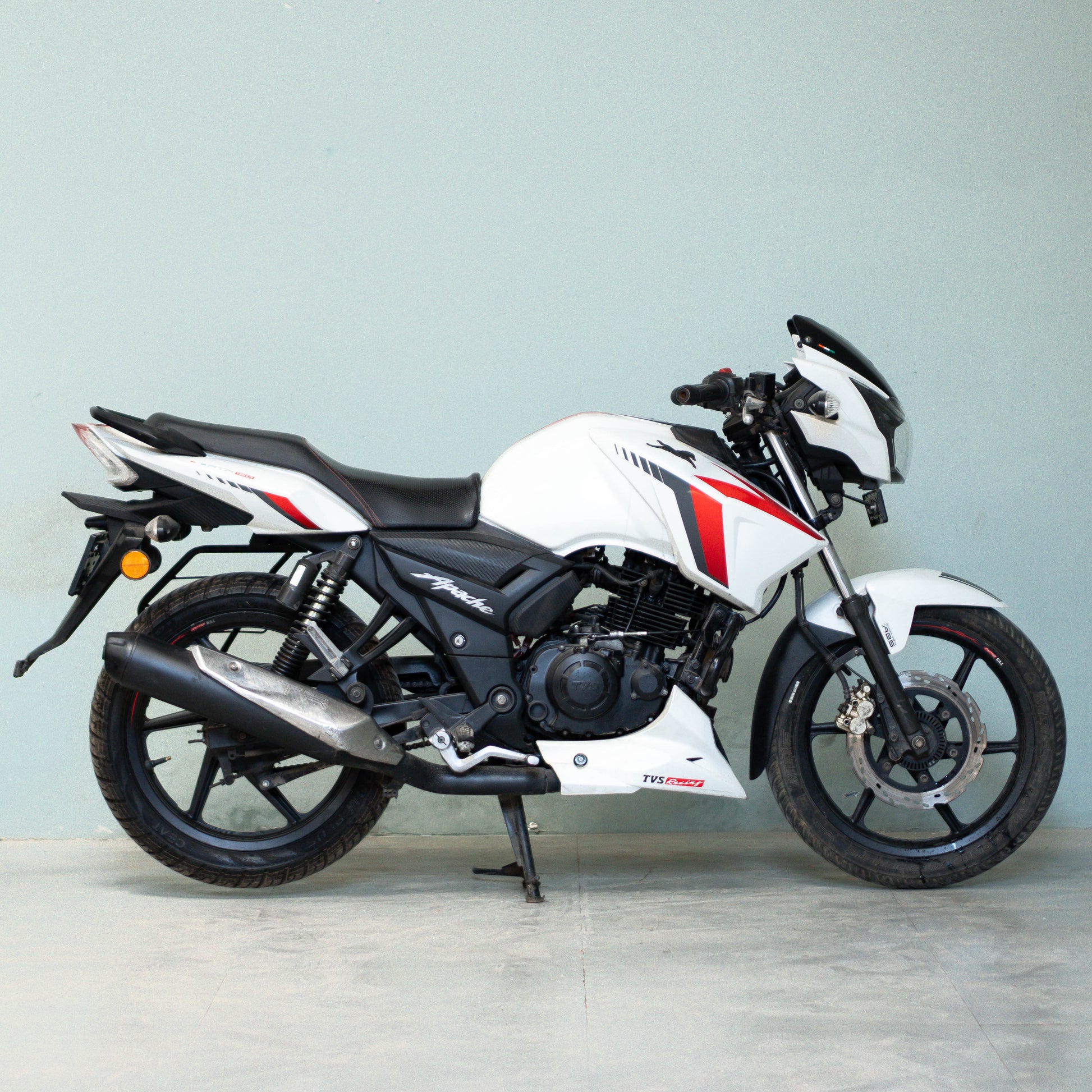 White motorcycle with black and red accents on a light gray background  TVS Apache RTR 160 4V Used Bike for Sale in Gurgaon