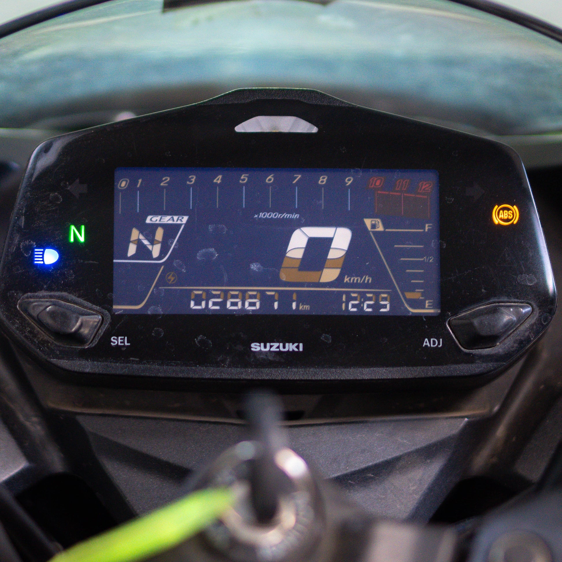 Close-up of a Suzuki motorcycle dashboard with digital display Suzuki Gixxer SF 250 resale price