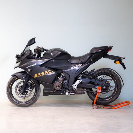 Black Suzuki motorcycle on a stand against a light gray background Gixxer SF 250 second hand price
