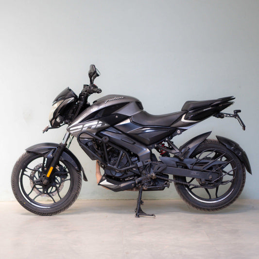 Black motorcycle on a light gray background